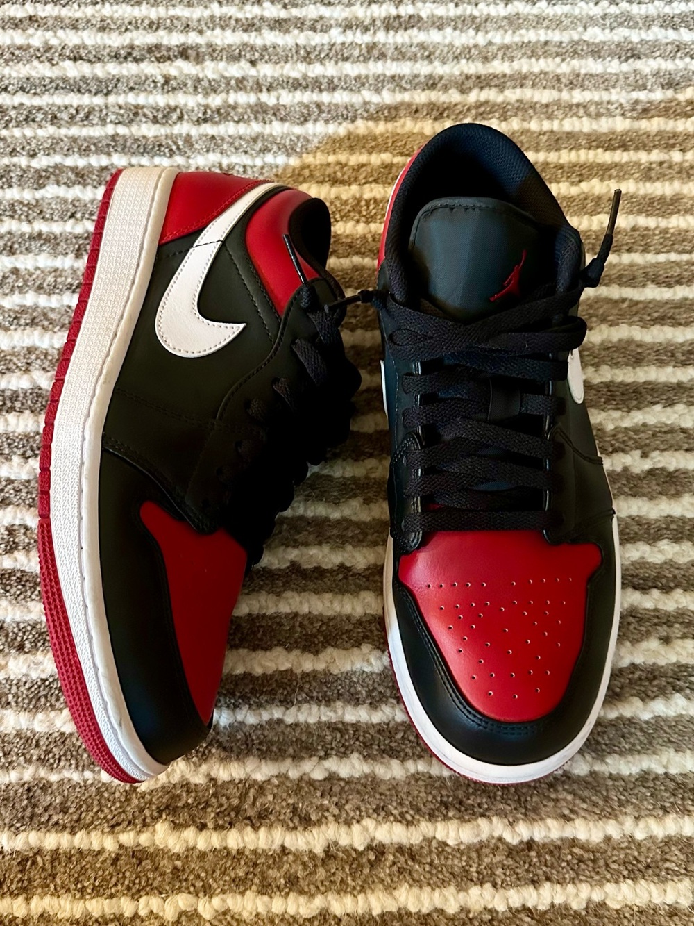 Nike Air Jordan 1 Low Sneakers in the "Alternate Bred Toe" colorway